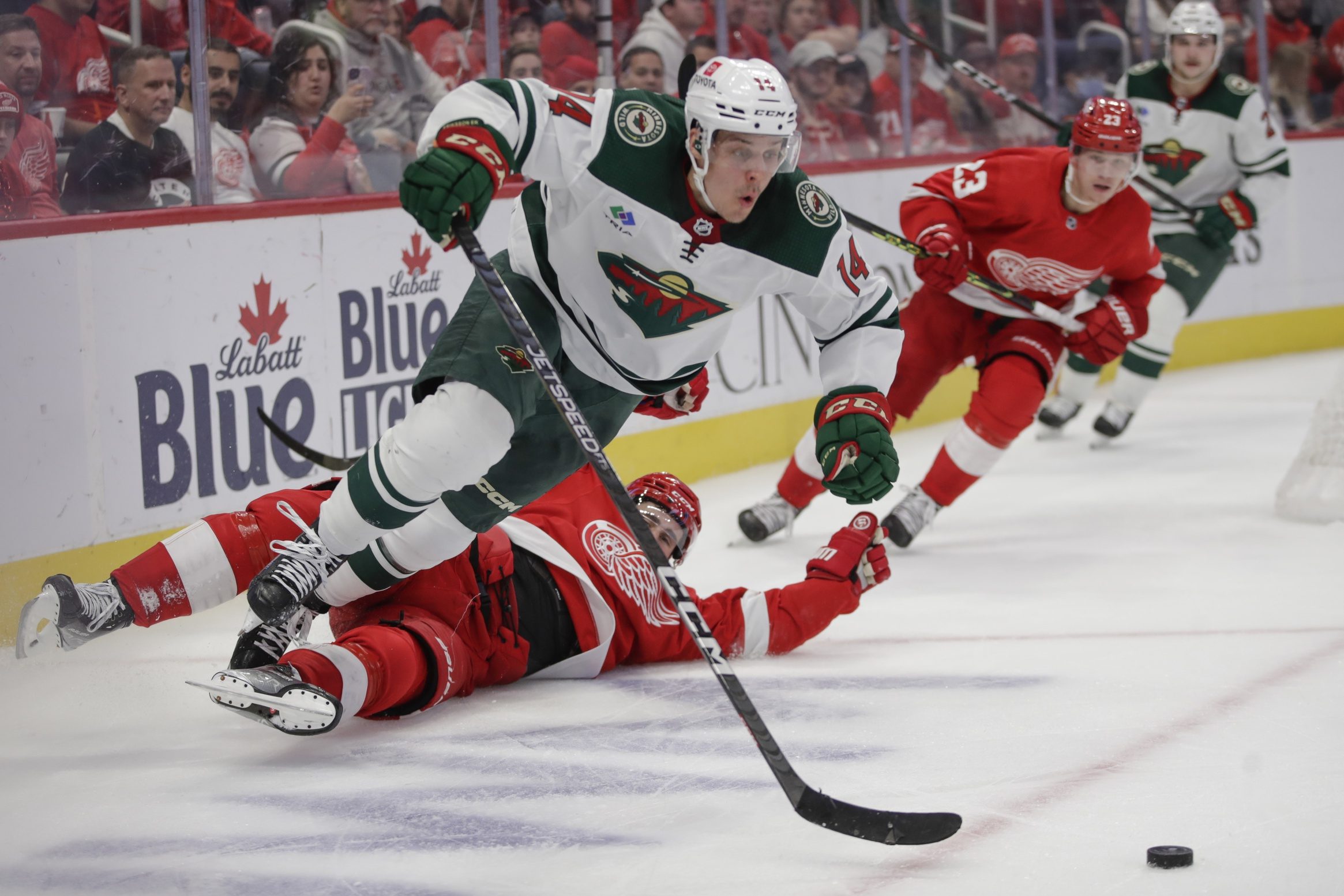 Wild fans threw dozens of hats onto the ice, then Joel Eriksson